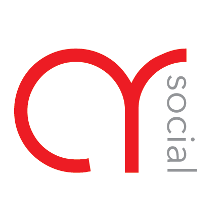 a white circle with red letters and a black background